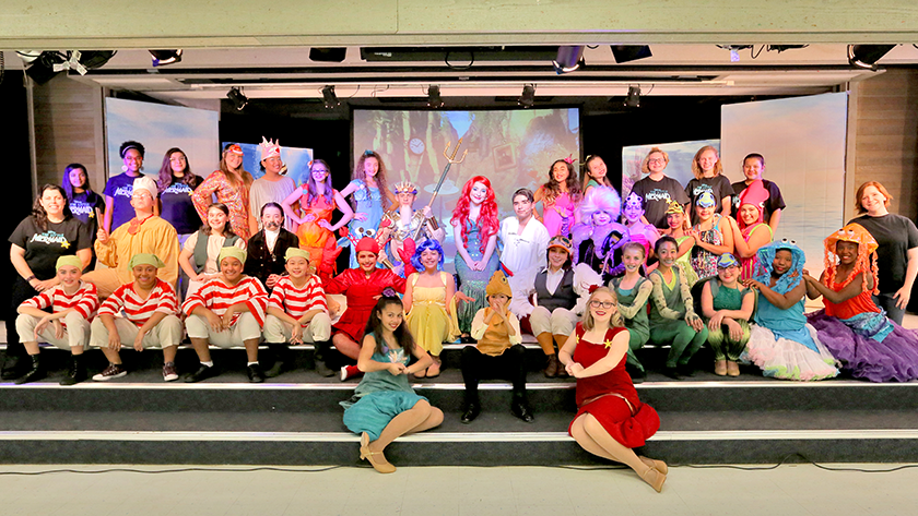The cast of "Little Mermaid" gather on stage