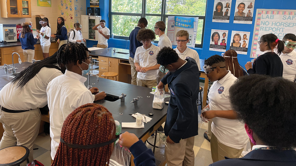 High school students work on a science lab.